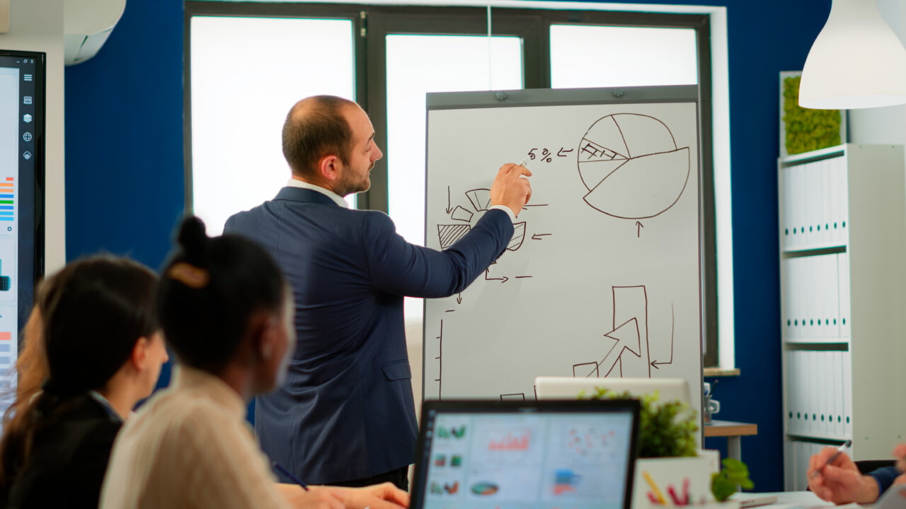 Professional business coache company leader teacher offering flip chart presentation